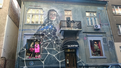Woman On A Building