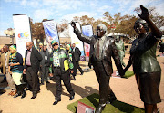 ANC President, Jacob Zuma looks at the lifesize statue of Walter Sisulu and Albertina Sisulu during his walkabout at the ANC Policy Conference held at Nasrec. Picture: Masi Losi