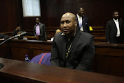 Former Blue Bull rugby player Phindile Joseph Ntshongwana at the Durban High Court on November 19, 2012 in Durban, South Africa. Ntshongwana is charged with hacking four people to death with an axe. File photo.
