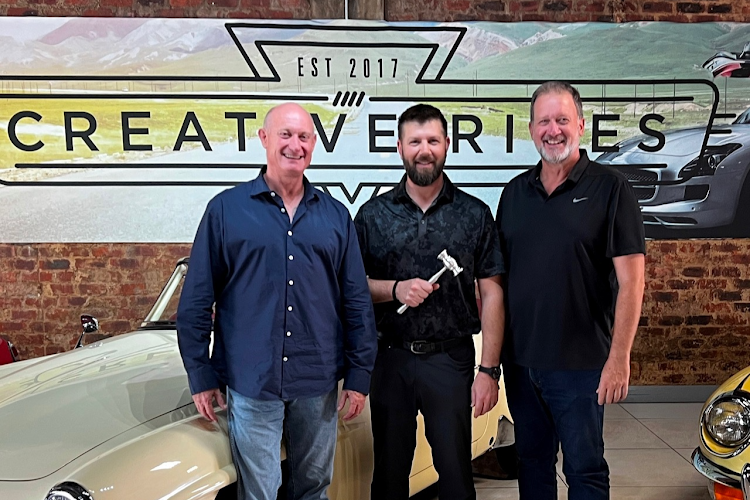 Creative Rides CEO Kevin Derrick, left, Joseph Mast, lead auctioneer of Barrett-Jackson Auction Company, and Creative Rides lead auctioneer Joff van Reenen.