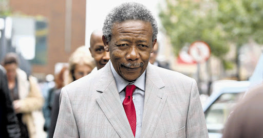 Cool customer: Former top cop Jackie Selebi is not serving his 15-year sentence in prison because he is 'gravely ill'. But he is able to go to the shops to buy the paper.