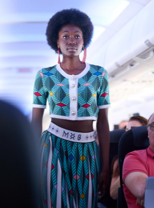 A model dressed in MaXhosa struts the runway onboard a flight from Johannesburg to Cape Town.