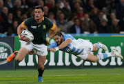 =Jesse Kriel of South Africa evades a challenge from Horacio Agulla of Argentina during the 2015 Rugby World Cup Bronze Final match between South Africa and Argentina at the Olympic Stadium in London, United Kingdom on October 30, 2015.