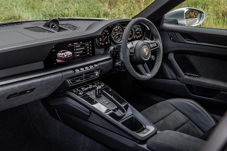 The cabin gets darkened treatment with black Race-Tex upholstery, along with a GT sports steering wheel. Picture: SUPPLIED