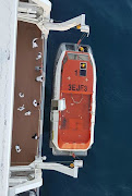 The ship's crew used a smaller boat to rescue the man.