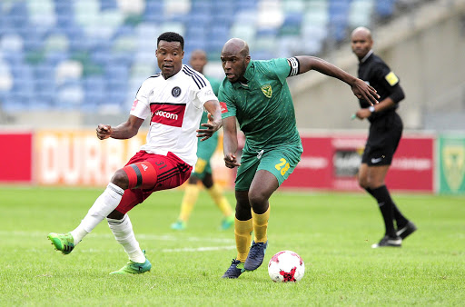 Musa Bilankulu, Captain of Lamontville Golden Arrows changes direction to get past the defence of Thamsanqa Gabuza of Orlando Pirates during the Absa Premiership 2016/17 game between Golden Arrows and Orlando Pirates at Moses Mabhida Stadium, Durban on 27 May 2017. Gerhard Duraan/BackpagePix