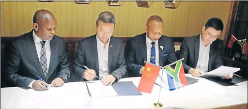 SIGNED AND SEALED: Eastern Cape finance MEC Sakhumzi Somyo, Billy Huang, who is the director of Shenzen Hengyue Industrial Development Company (IDC), East London IDZ CEO Simphiwe Kondlo and chairman of the Shenzen Hengyue IDC Jerry Li sign bilateral deals Picture:Picture: SUPPLIED