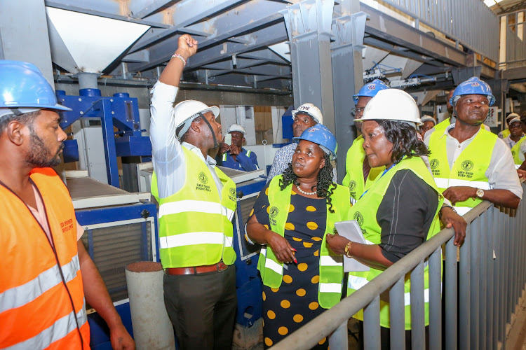 Cabinet Secretary for EAC and Regional Development Peninah Malonza during an inspection at the LBDA rice mill plant in Kisumu