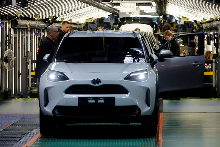 Employees work on the Yaris car assembly line at a Toyota plant in Onnaing near Valenciennes, France. File photo: PASCAL ROSSIGNOL/REUTERS
