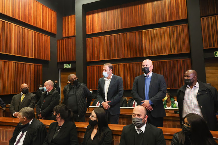 In the dock at the specialised commercial crimes court sitting in Palm Ridge magistrates court in May are, from left, Kuben Moodley, Eric Wood, Siyabonga Gama, Garry Pita, Daniel Roy and Phetolo Ramosebudi. File photo.