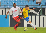 Ali Meza (R) of Mamelodi Sundowns is tackled by man-of-the-match Junior Sibande of Highlands Park during the Absa Premiership match at Loftus Versfeld Stadium in Pretoria on August 22 2018.  