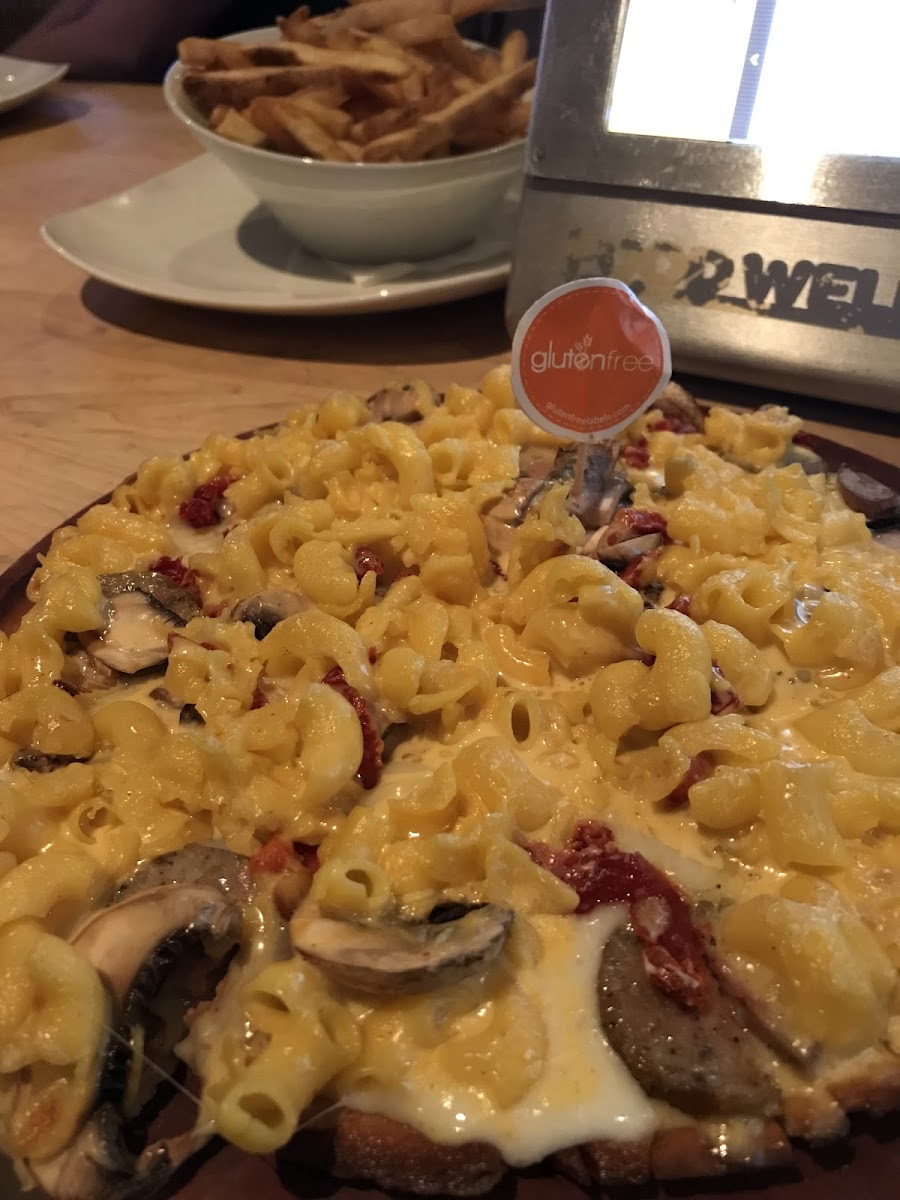 Macaroni and cheese, mushrooms, and sundried tomatoes on a GF pizza crust. Random, and delicious. Love that they use Gluten Free tags in the food
