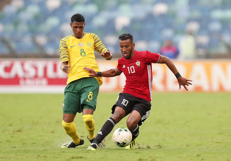 Bafana Bafana debutant Vincent Pule (L) tussles for the ball with Hamdou Elhouni (R) of Libya during the 2019 African Cup Of Nations qualifier at the Moses Mabhida Stadium, Durban on September 8 2018.