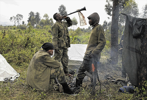 Congolese Army soldiers in Kilimanyoka village. They say the vuvuzela scares M23 rebels. There are more than 1300 South African soldiers in the DRC as part of a UN intervention brigade.