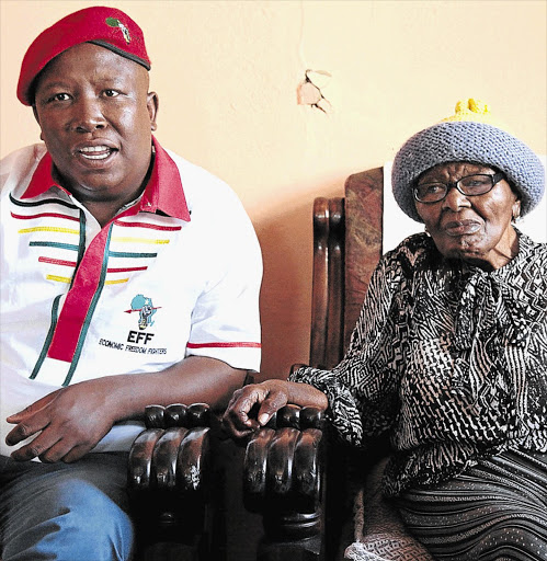 Julius Malema with Epainette Mbeki, mother of former president Thabo Mbeki in 2014.