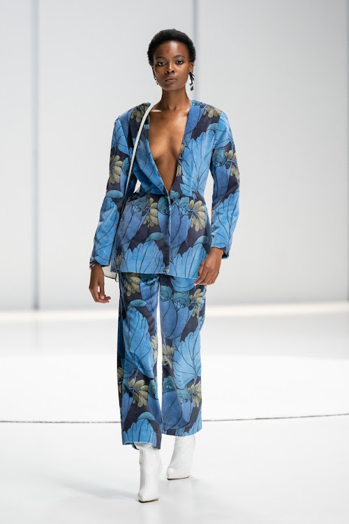 A model walks the Michael Ludwig SA Fashion Week Spring Summer 2024 in a botanical-inspired power suit.