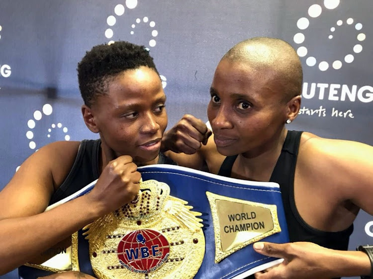 Mapule Ngubane, left, and WBF junior middleweight champ Noni Tenge before their fight.