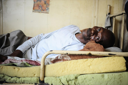 November 11, 2016. Lesotho national, Phillip Phamotse , who suffers from TB, lies in his bed at the Circle Labour Hostel in Rustenburg, North West. Pic: Thulani Mbele