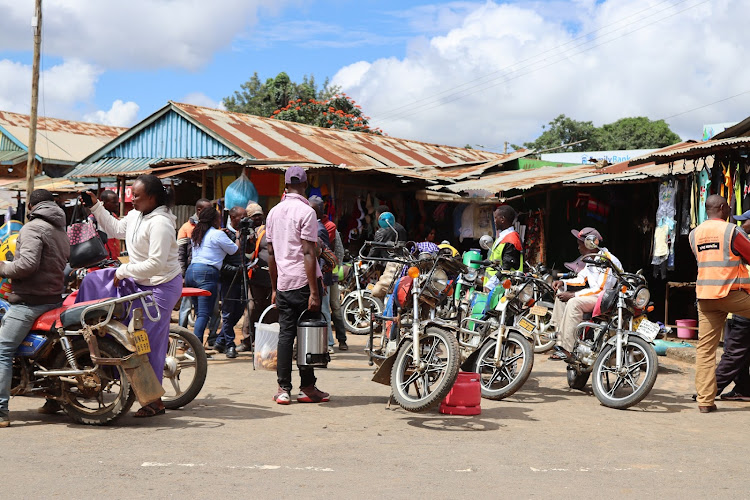 A section of Boda boda riders huddle together at a passenger collection point in Kitui town recently.