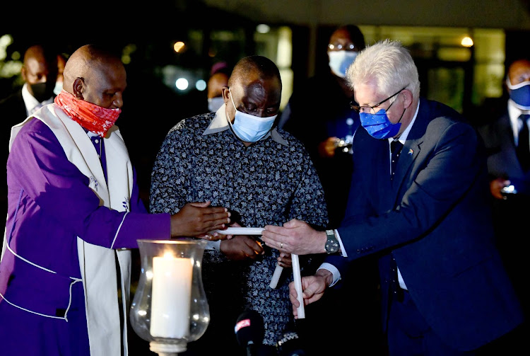 President Cyril Ramaphosa lit a candle to honour health-care workers in SA, many of whom have succumbed to Covid-19, as health minister Zweli Mkhize revealed that positive cases had breached the 18,000 mark in a single day.