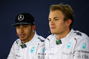 SAO PAULO, BRAZIL - NOVEMBER 08:  Lewis Hamilton of Great Britain and Mercedes GP speaks next to Nico Rosberg of Germany and Mercedes GP during a press conference after qualifying for the Brazilian Formula One Grand Prix at Autodromo Jose Carlos Pace on November 8, 2014 in Sao Paulo, Brazil.  (Photo by Mark Thompson/Getty Images)