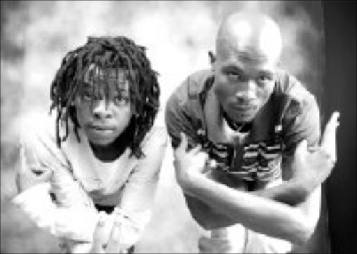 CODE LANGUAGE: Themba Molefe and Thabo "Bomba" Nkepane, members of the new kwaito group, Via Mchini. Pic. Matthews Baloyi. © Unknown.