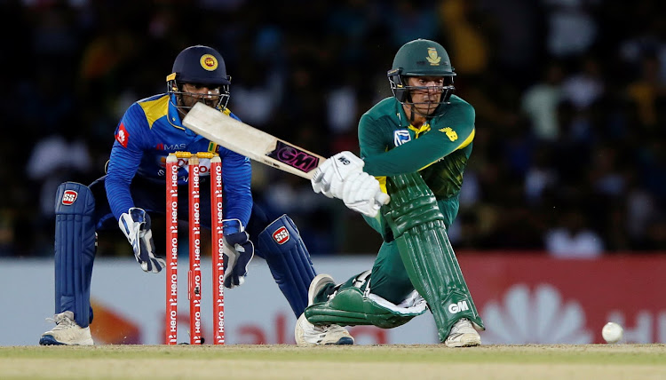 South Africa's Quinton de Kock plays a shot next to Sri Lanka's wicketkeeper Kusal Perera during their second ODI match against Sri Lanka in Dambulla.