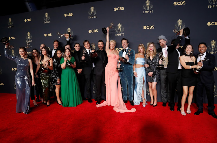 The cast and crew members of the comedy series 'Ted Lasso' with their awards at the 73rd Primetime Emmy Awards.