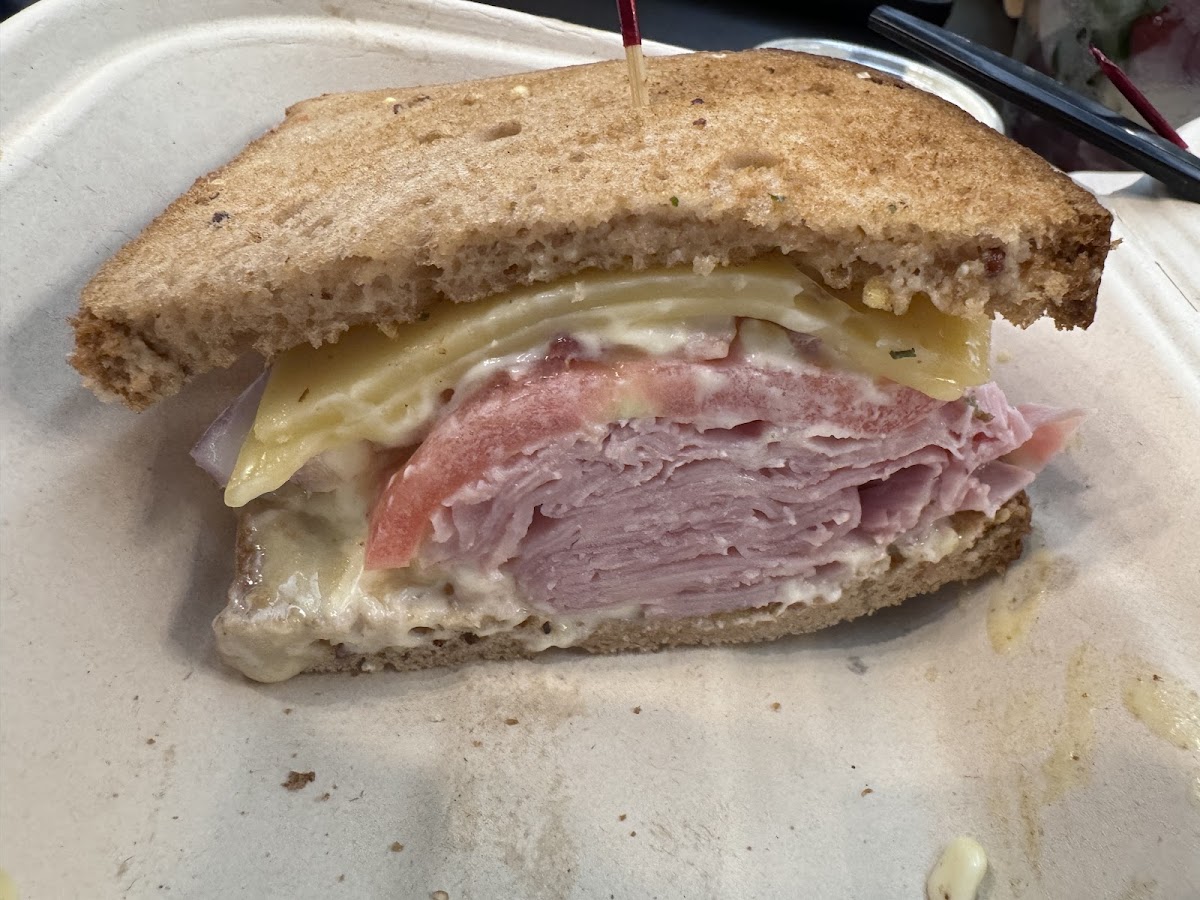 Gluten-free ham sandwich with Swiss cheese, mayonnaise, and honey mustard
