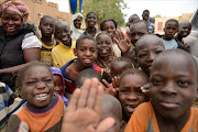Children celebrate in Diafouke as Malian and French soldiers entered the historic city of Timbuktu.
