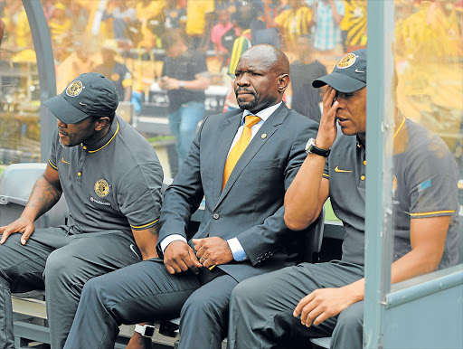 SITTING ON HOT COALS: Kaizer Chiefs coach Steve Komphela, centre, flanked by his team’s goalkeepers coach Brian Baloyi, left, and assistant coach Doctor Khumalo during the Premier League match they lost 3-1 to Orlando Pirates at FNB Stadium on Saturday. Amakhosi will face Golden Arrows tonight Picture: GALLO IMAGES