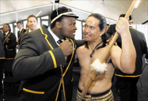 FACE-OFF: Springboks hooker Chilliboy Ralepelle, left, jokes with Toa Waaka at a welcoming ceremony in Wellington yesterday. Photo: REUTERS