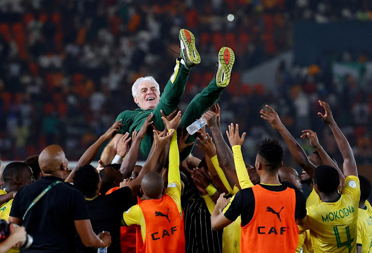 Bafana players celebrate with coach Hugo Broos after winning the penalty shootout against DR Congo in the Africa Cup of Nations’ third-place playoff at Stade Felix Houphouet-Boigny Stadium in Abidjan, Ivory Coast.