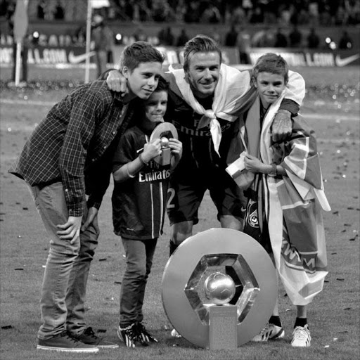 David Beckham with his sons after PSG's league win