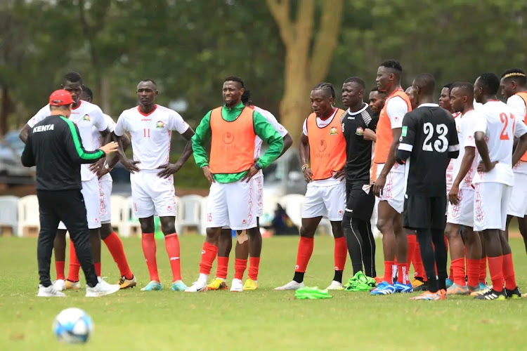 Harambee Stars coach Engin Firat chats with his players during a training session at Kasarani Annex