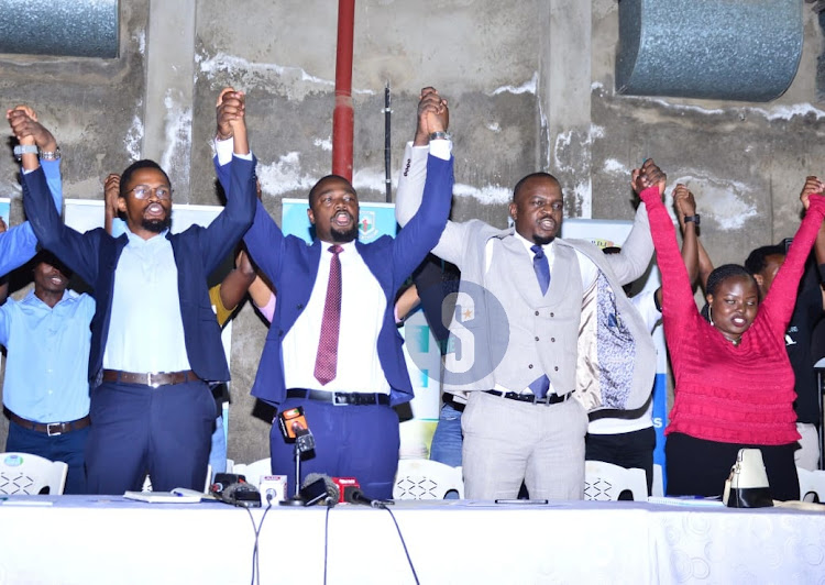 Secretary General of the Kenya Medical Practitioners Pharmacists and Dentists Union (KMPDU), Davji Bhimji Atellah and Chairman KMPDU Abi Mwachi leads in solidarity demanding for posing of Medical graduates by the Ministry of Health at KMA auditorium in Nairobi on February 20,2024