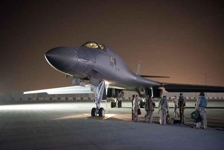 A US Air Force B-1B Lancer and crew, being deployed to launch strike as part of the multinational response to Syria's use of chemical weapons, is seen in this image released from Al Udeid Air Base, Doha, Qatar on April 14, 2018.