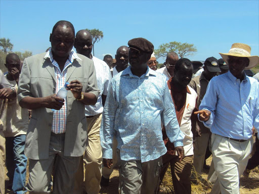 A file photo of ODM leader Raila Odinga and the late Otieno Kajwang' at the proposed site of the Lamu port. /ALPHONCE GARI