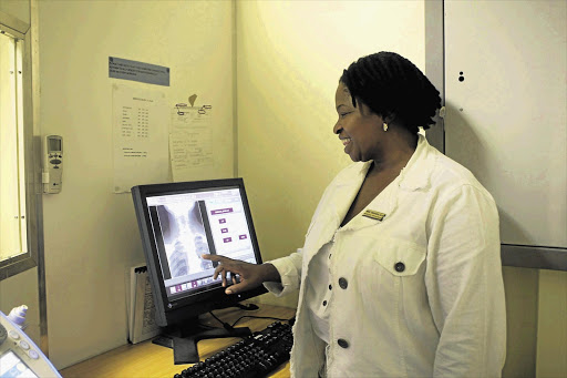 A radiologist at the Tshwane District Hospital checks an X-ray of a patient Picture: PEGGY NKOMO