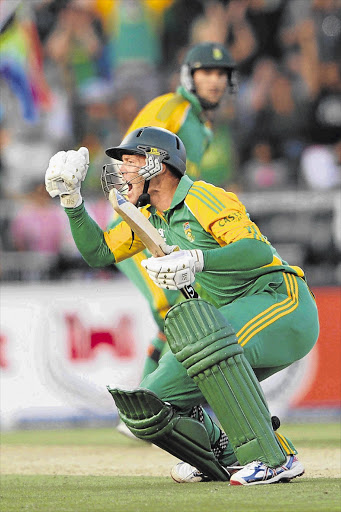 Rusty Theron celebrates after hitting the six that won the the second T20 international between South Africa and Australia at the Wanderers in Johannesburg yesterday Picture: LEE WARREN/GALLO IMAGES