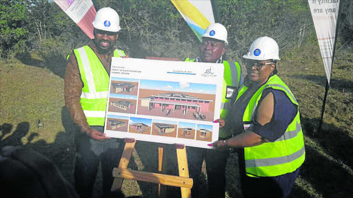 MUCH APPRECIATED: Health MEC Dr Pumza Dyantyi, right, with contractor Khaya Mbewi of Kenix Power Projects, left, and Ngqushwa mayor Solomzi Ndwayana, centre, handing over the new Hamburg clinic site at the coastal village community earlier this week Picture: SUPPLIED