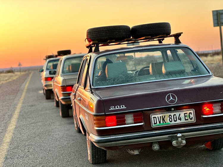 The convoy pauses to take in an African sunset.