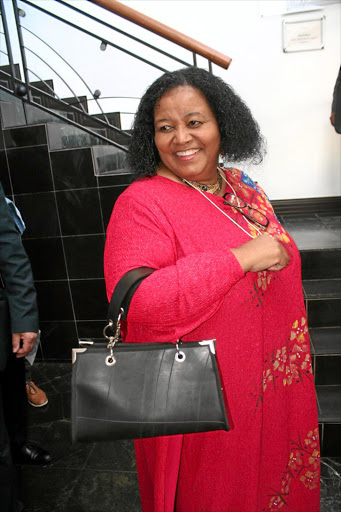 A WAY WITH WASTE: Environment Minister Edna Molewa models a snazzy 'junk handbag'