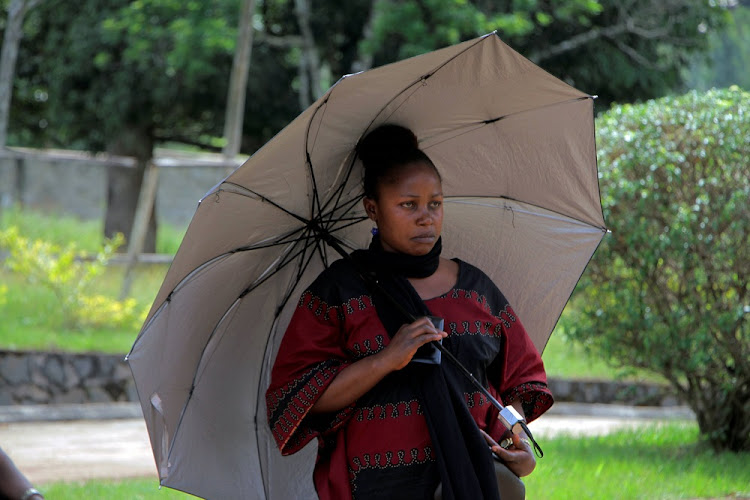 A woman awaiting news of her child at a school where 79 children were kidnapped in Bamenda, Cameroon on Tuesday. All 79 children were later released.