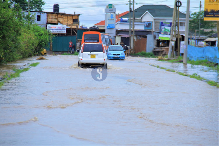 Vehicles stall along the flooded Syokimau - Katani road in Machakos County on Sunday, April 21, 2024.