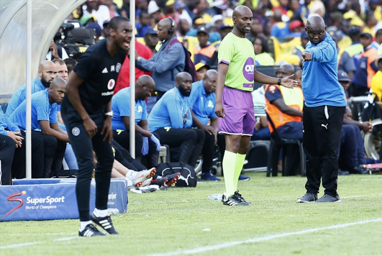 Mamelodi Sundowns coach Pitso Mosimane asks the match fourth official to get Orlando Pirates' assistant coach Rulani Mokwena back into his designated technical area during the emotionally-charged Absa Premiership encounter at Loftus on Saturday November 10, 2018.