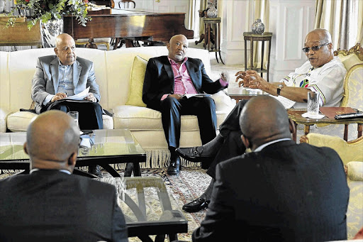 HOLDING THE LINE: Finance Minister Pravin Gordhan with his deputy, Mcebisi Jonas, and President Jacob Zuma at a pre-Budget meeting. He has shown the mettle, the character of a hero, by standing up against the abuse of power