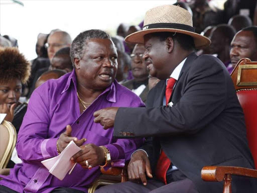 Cotu secretary general Francis and Opposition leader Raila Odinga at a past function. /COURTESY