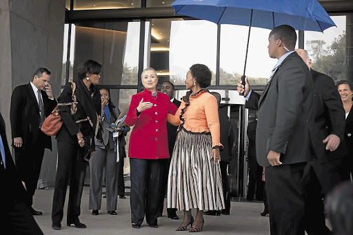 US Secretary of State Hillary Clinton and Minister of International Relations and Cooperation Maite Nkoana-Mashabane leave the OR Tambo Building in Pretoria yesterday Picture: DANIEL BORN