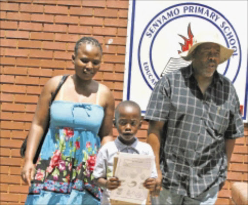 BEGINNER: Njabulo Ndlovu is excited after his parents Enock and Nomsa Ndlovu registered him at Senyamo primary school in Dobsonville, Soweto, to start grade 1. Parents were lucky to get a registration for their child even after missing the deadline. Pic: BAFANA MAHLANGU. 11/01/2001. © Sowetan